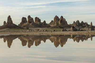 Trona pillars reflected in pond