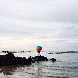 Scenic view of sea against cloudy sky