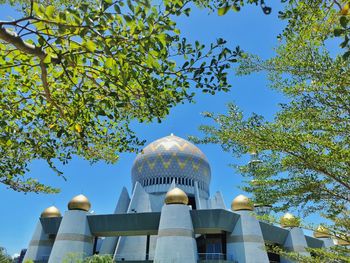 Low angle view of building against blue sky