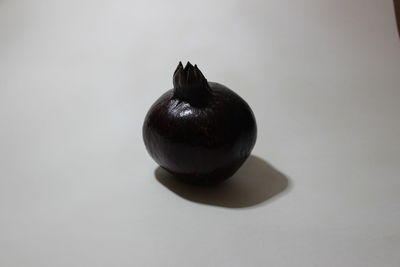 High angle view of apple on table against white background