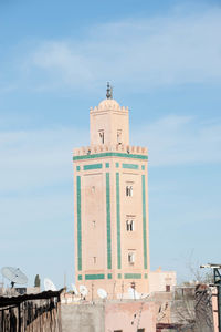 Buildings against blue sky and clouds