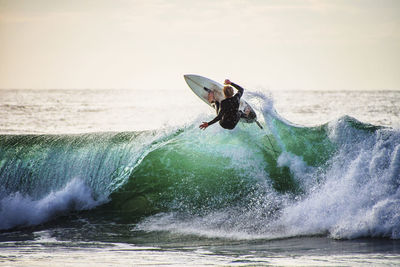 Man surfing in sea waves