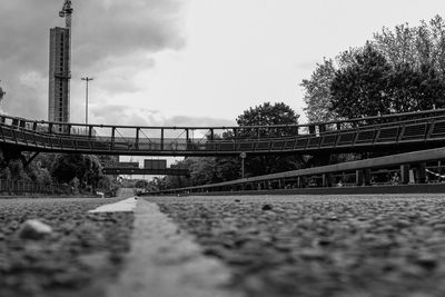 Surface level of railroad tracks against sky