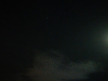 Low angle view of moon in sky at night