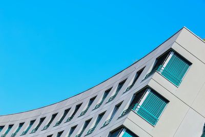 Low angle view of building against clear blue sky