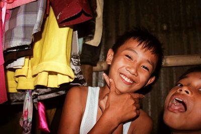 Portrait of smiling boy sitting in traditional clothing