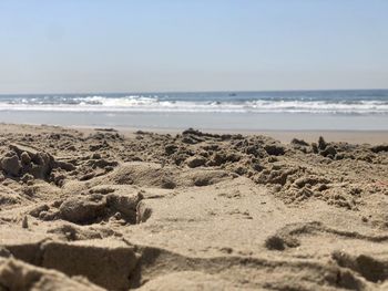 Scenic view of beach against clear sky