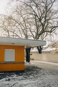 House on snow covered landscape