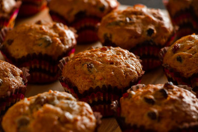 Appetizing homemade muffins on a wooden cutting board. traditional festive christmas baking.