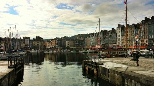 Boats moored at harbor