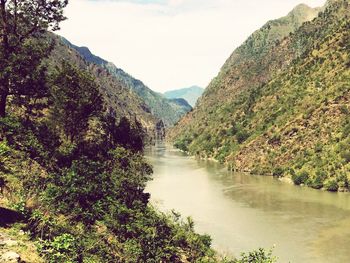 Scenic view of river and mountains