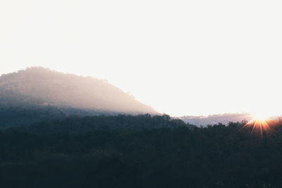 Scenic view of mountains against clear sky during sunset