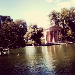 View of building with trees in water