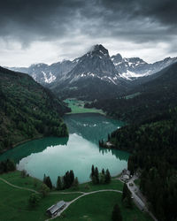 Scenic view of lake and mountains against sky