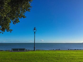 Scenic view of sea against clear blue sky