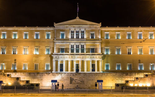 Facade of historical building at night