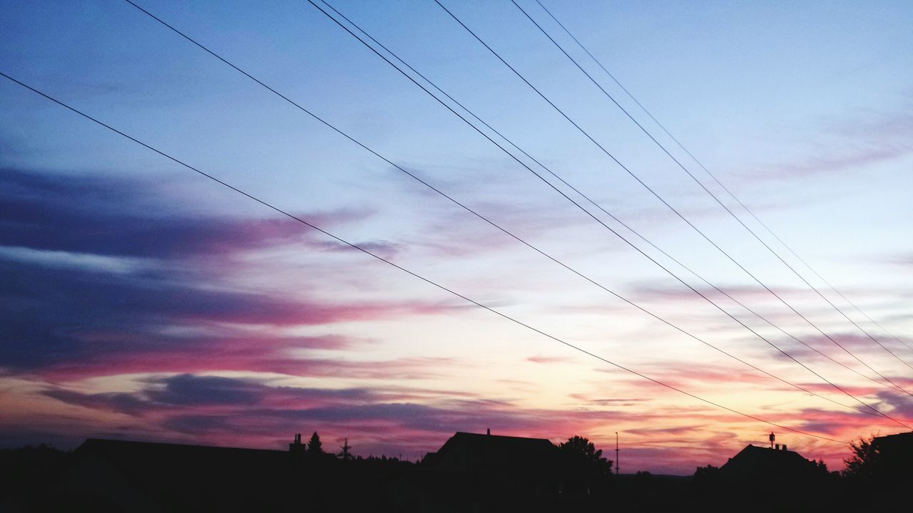 SILHOUETTE OF ELECTRICITY PYLON AGAINST CLOUDY SKY