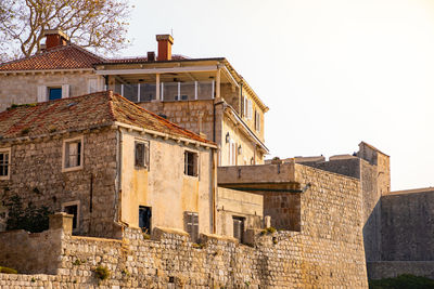 Low angle view of old building against clear sky