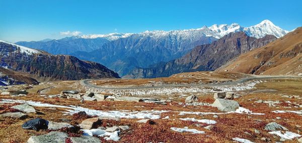 Scenic view of snowcapped mountains against sky