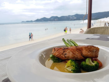 Close-up of food served in plate at restaurant on the beach.