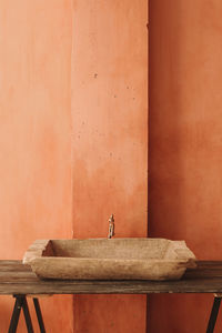 Minimalistic interior style. vintage sink on a wooden shelf. home design