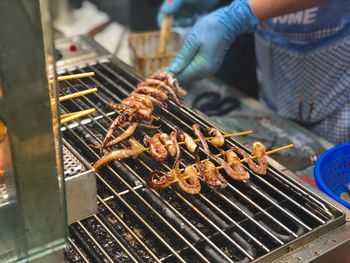 Close-up of meat on barbecue grill