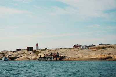 Scenic view of sea and shore against sky