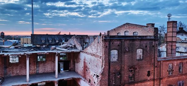 View of buildings against cloudy sky