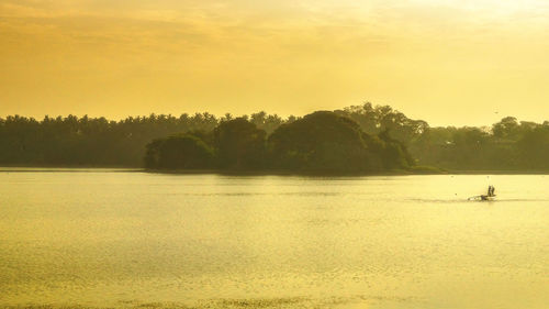 Scenic view of sea at sunset