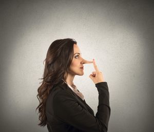 Portrait of woman against wall