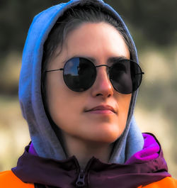 Portrait of young woman wearing sunglasses