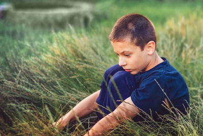 Boy looking away on land