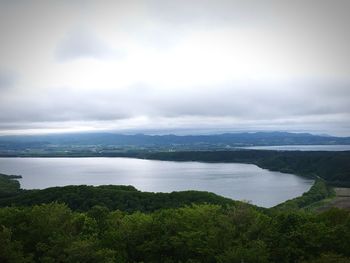 Scenic view of sea against cloudy sky