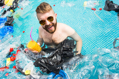 Portrait of a young man in swimming pool