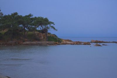 Scenic view of sea against blue sky