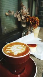 Close-up of cappuccino on table