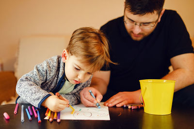 Mother and son on table