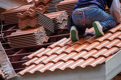 Low angle view of roof tiles outside building