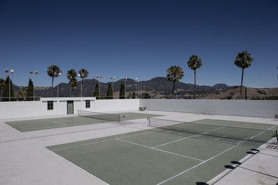 Tennis courts against clear sky