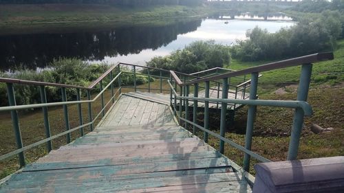 Wooden footbridge over lake