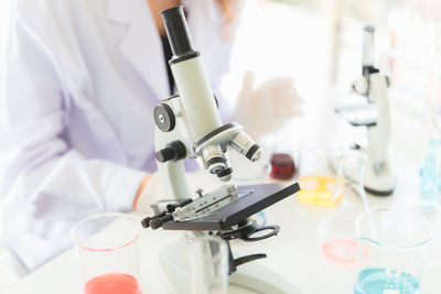 Midsection of person with camera