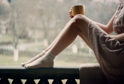 Close-up of woman sitting outdoors