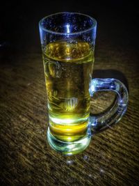 Close-up of beer glass on table