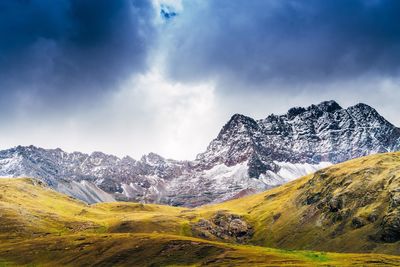 View of snowcapped mountain against cloudy sky