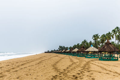 Scenic view of beach against clear sky