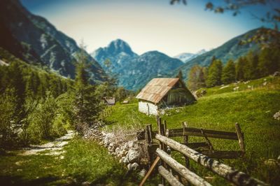 Houses by mountains against sky