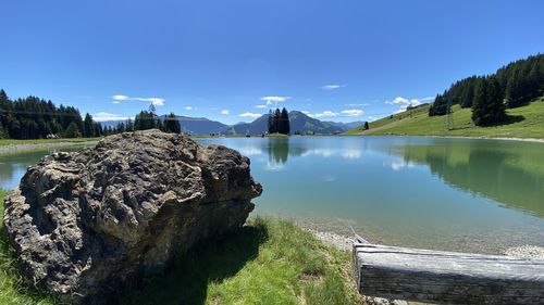 Scenic view of lake against sky in the alps