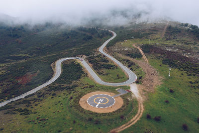 High angle view of winding road on landscape