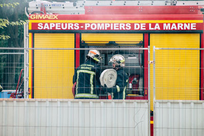 People standing in front of a store