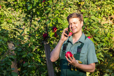 Young woman holding apple